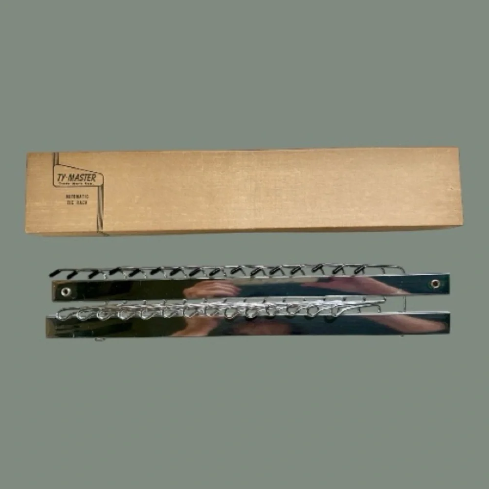 VINTAGE, TY-MASTER, AUTOMATIC TIE RACK. CHROME-PLATED. 13 3/4”W X 2 3/8”H